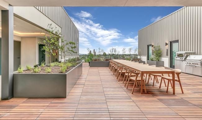 Find your perfect fit at The Rinrose a patio with tables and chairs