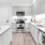 a kitchen with white cabinets