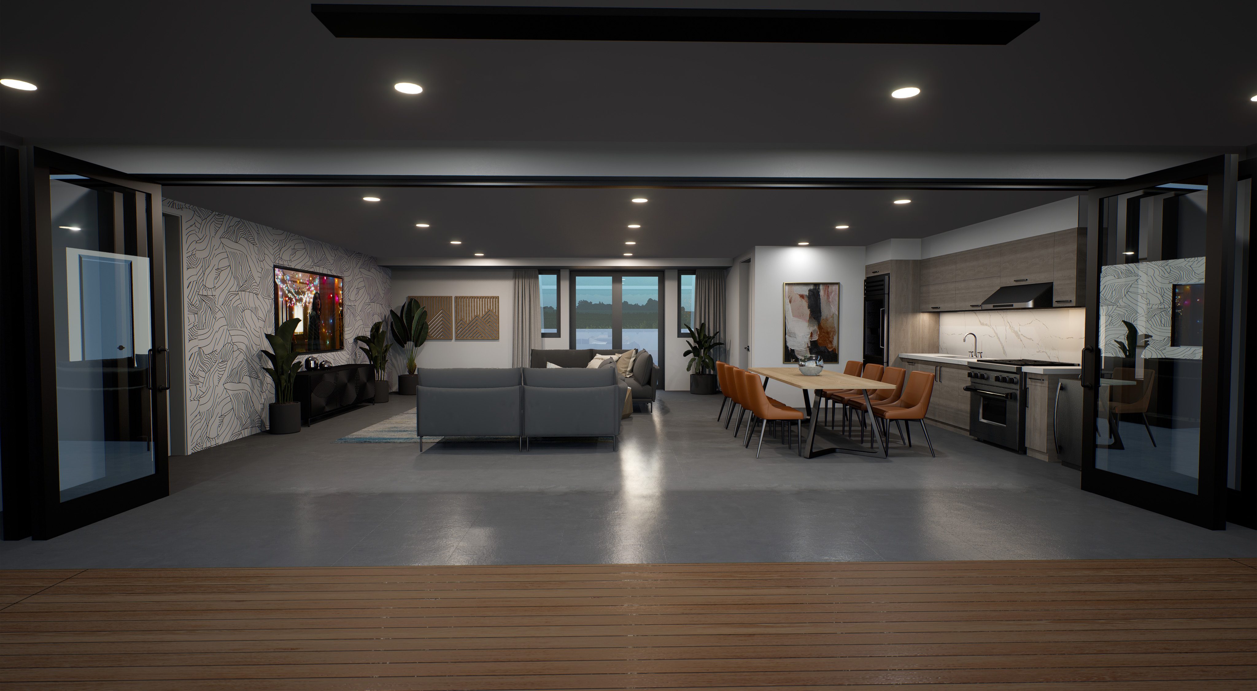 Open lounge/kitchen area with gray couches, brown leather seating at table and kitchenette