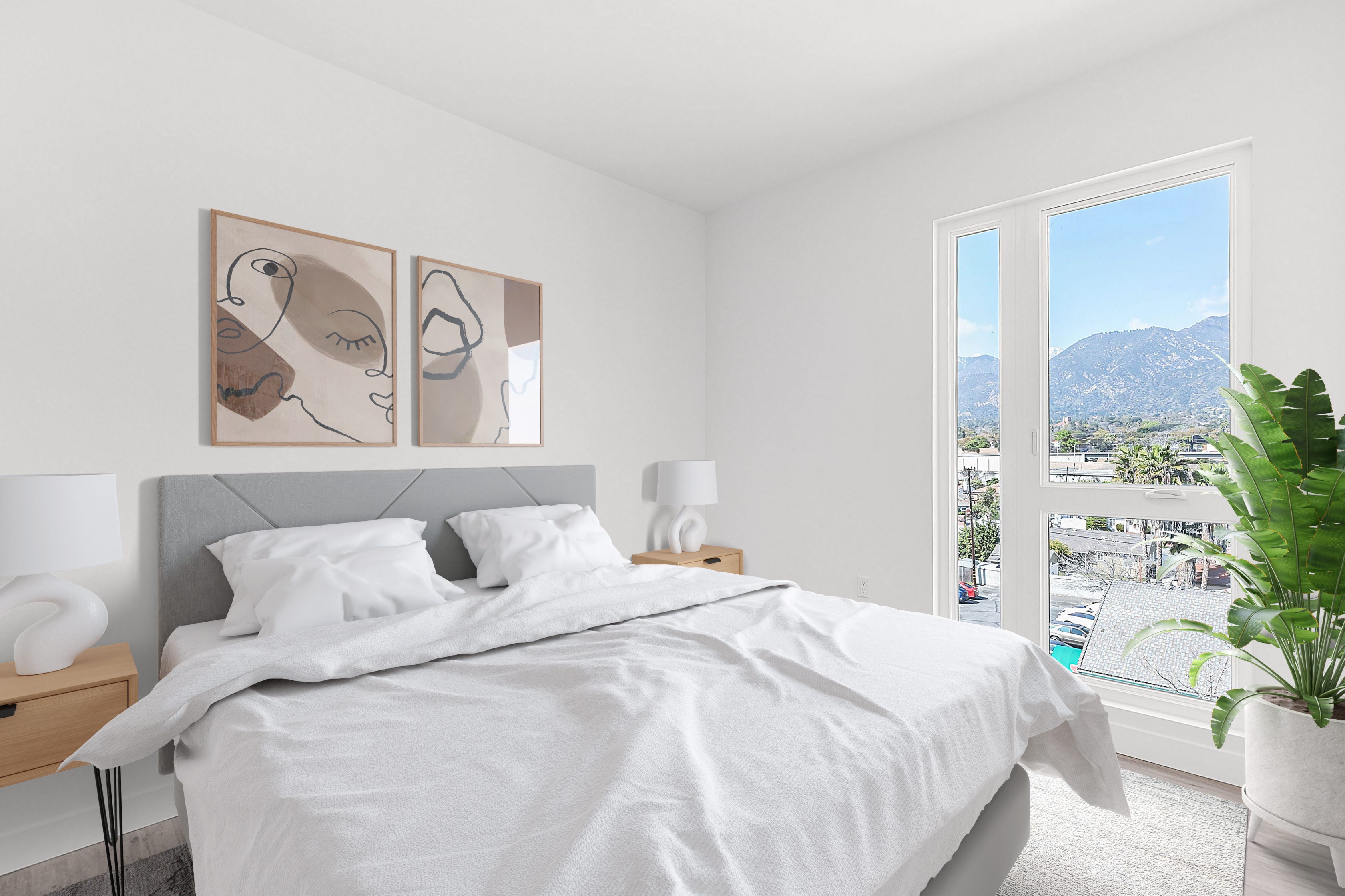 An apartment bedroom with a white bed and a view of mountains in Pasadena.