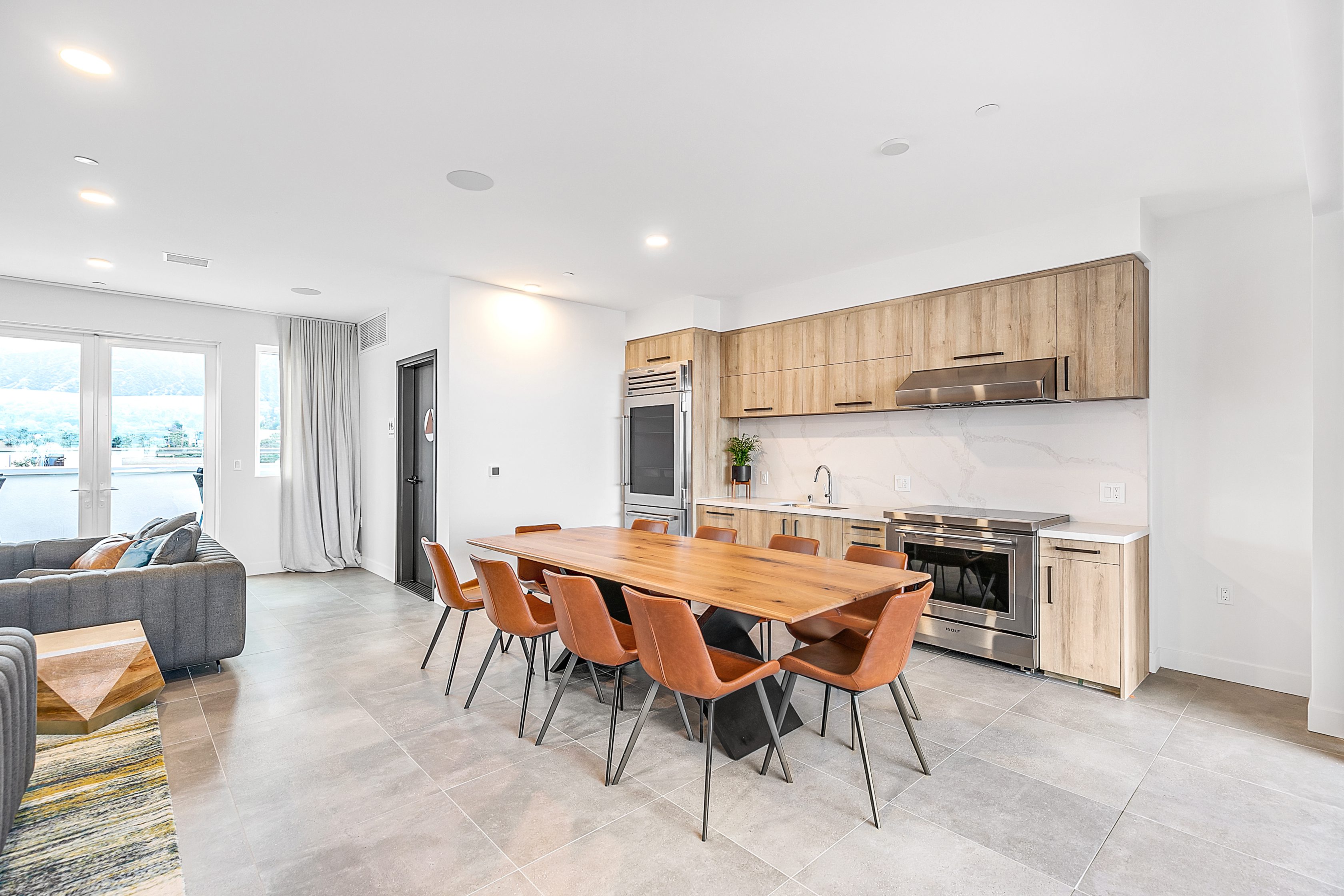 The Rinrose: A multifamily apartment with a modern kitchen and dining area.